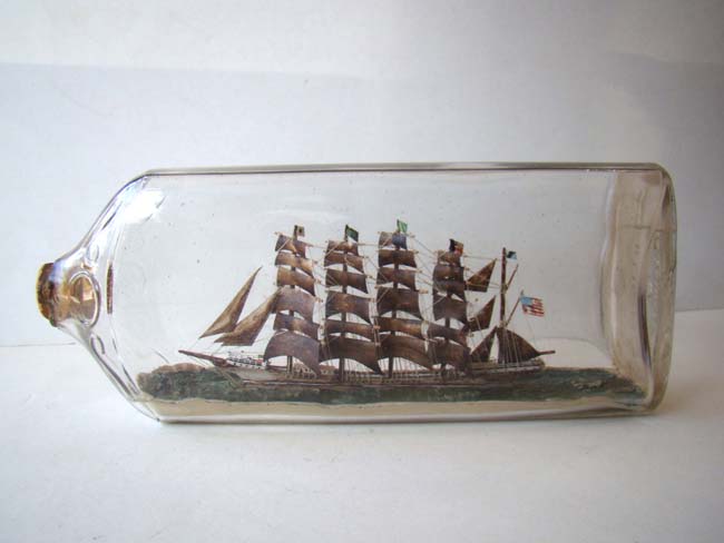 A highly detailed five-masted ship in a Bottle flying the American flag circa 1900